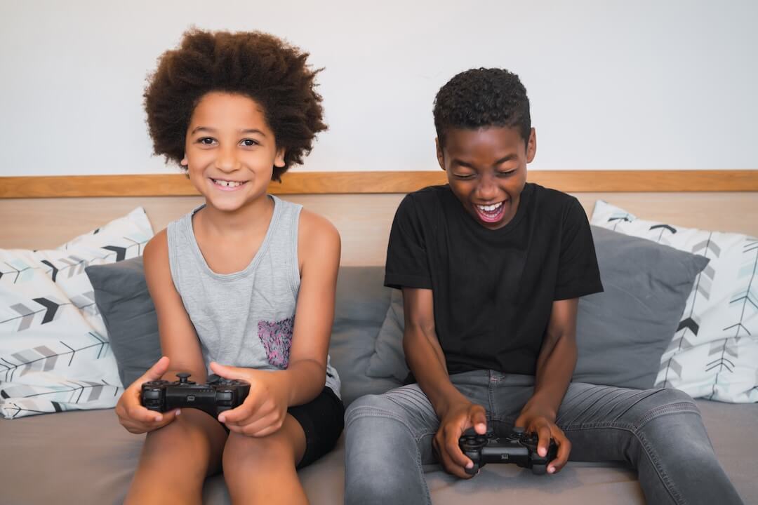 two brothers playing video games home